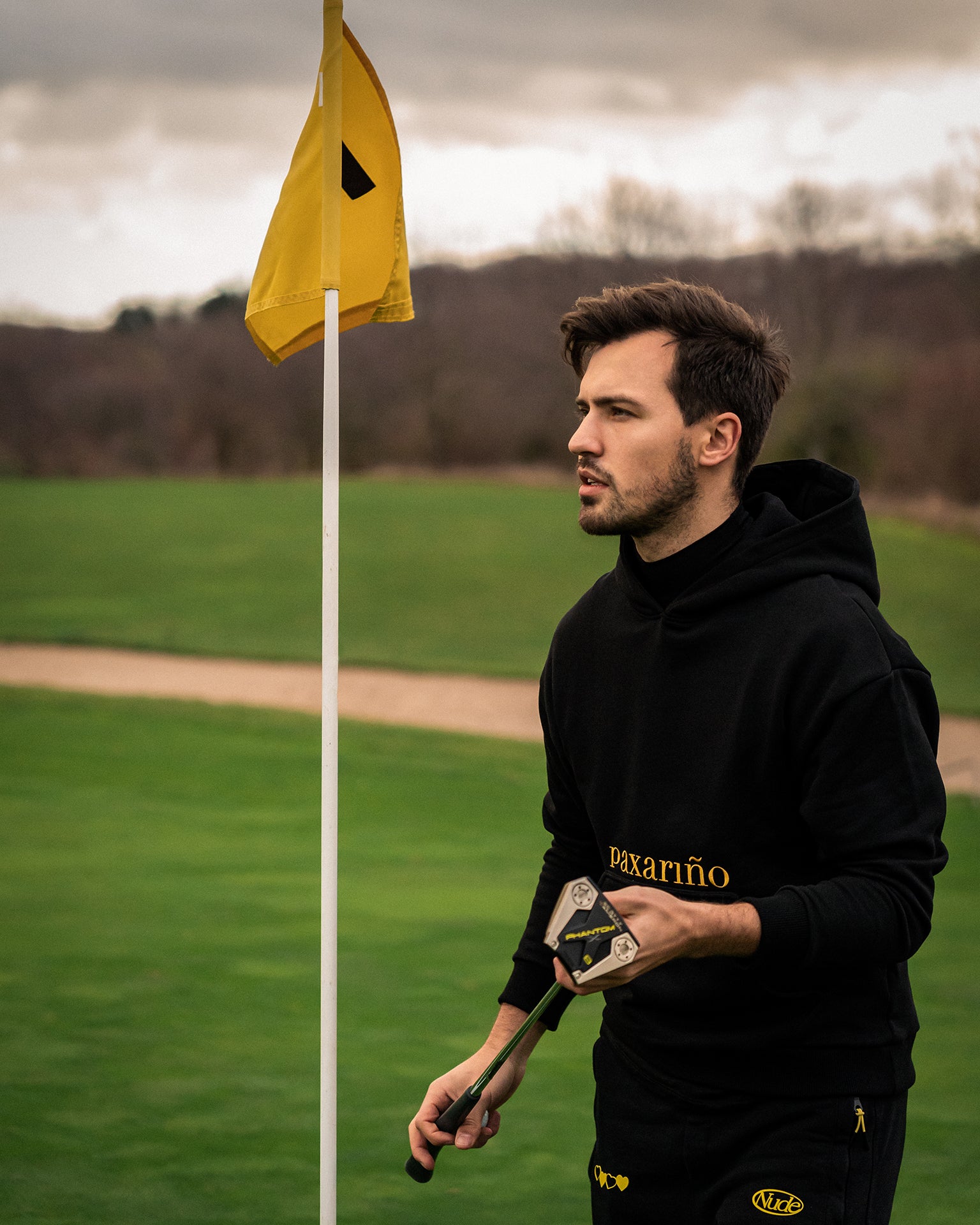 Co-Founder Cedric wearing the "revolución" Hoodie on the golf course.