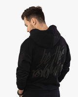 Rückansicht schwarzer Golf Hoodie aus Bio-Baumwolle für Herren von paxariño.